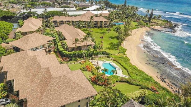 A resort with multiple buildings, a beach, and a swimming pool. - *NEW* Oceanfront Wailua Days at Lanikai, Steps from Lae Nani (Kapaa)