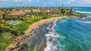 A coastal resort with a beach, clear waters, and a pool. - *New* Oceanfront Wailua Escape Near Lae Nani Beach (Kapaa)