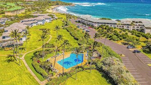 A resort with a swimming pool, beachfront view, and multiple buildings. - New Ground-Floor Poipu Escape Near Shipwreck Beach (Koloa)