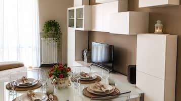 Deluxe Apartment, Balcony | Living area | Flat-screen TV
