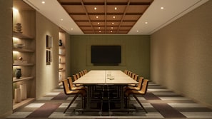 A conference room with a long table, chairs, a projector screen, and shelves with books and decorative items. - DoubleTree By Hilton Singapore Robertson Quay (Singapore)