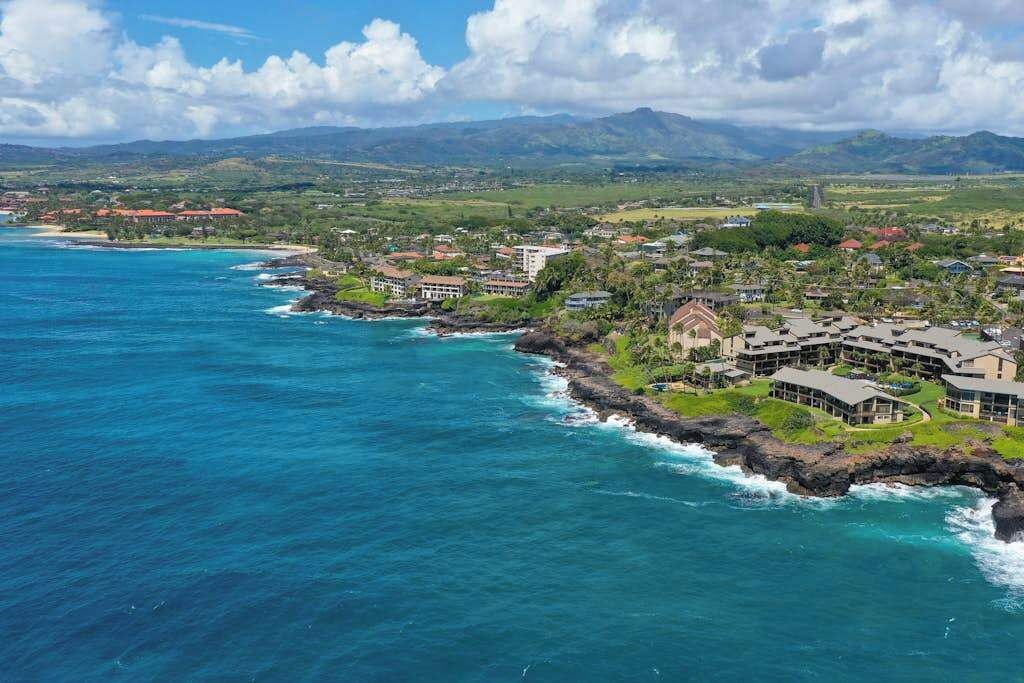 A coastal resort with ocean views, a rocky shoreline, and a mix of residential and commercial buildings.