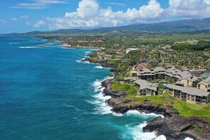 A coastal resort with ocean views, multiple buildings, and a rocky shoreline. - *NEW* Fall Special Poipu Coastal Trail Escape with Pool, Hot Tub, and AC (Poipu)