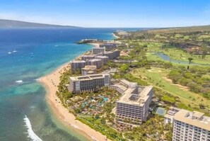 A coastal resort with beachfront buildings, a golf course, and a clear view of the ocean. - Oceanview Honua Kai Konea Condo- Waterslide Pool, Lazy River, Beach, AC, Laundry (Lahaina)