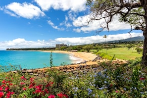 A coastal landscape with a beach, clear sky, and distant mountains. - NEW Kaanapali Studio with Golf and Ocean Views Near the Beach (Lahaina)