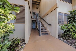 A multi-level building with a central staircase connecting the floors. - *NEW* Fall $pecial Ground-Floor Beachfront Lahaina Condo with Pool (Lahaina)
