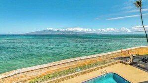 A pool with a view of the ocean and a mountain range in the distance. - *New* Fall Deal Panoramic Kahana Oceanfront for Two (Lahaina)
