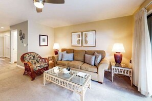 A living room with a sofa, armchair, coffee table, and two side tables with lamps. - *New* Fall $pecial A Family-Friendly South Kihei Stay Near Kamaole III (Kihei)