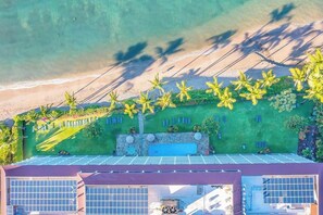 A rooftop with solar panels, a swimming pool, and a view of the beach. - *New* Fall $pecial Renewed Lahaina Shores Beachfront with Pool and Spa (Lahaina)