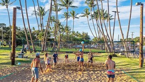 A beach volleyball game on a sandy court with palm trees in the background. - *NEW* Fall $ale Ocean-View Kihei Escape Steps from The Cove (Kihei)
