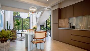Luxury Studio, 1 King Bed, Balcony | Private kitchen | Stovetop, coffee/tea maker, electric kettle, cookware/dishes/utensils