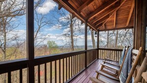A wooden deck with a view of trees and hills. - Mountain Memories 2 (Sevierville)