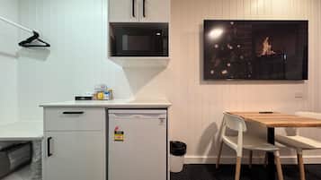 Mini-fridge, microwave, electric kettle, cookware/dishes/utensils
