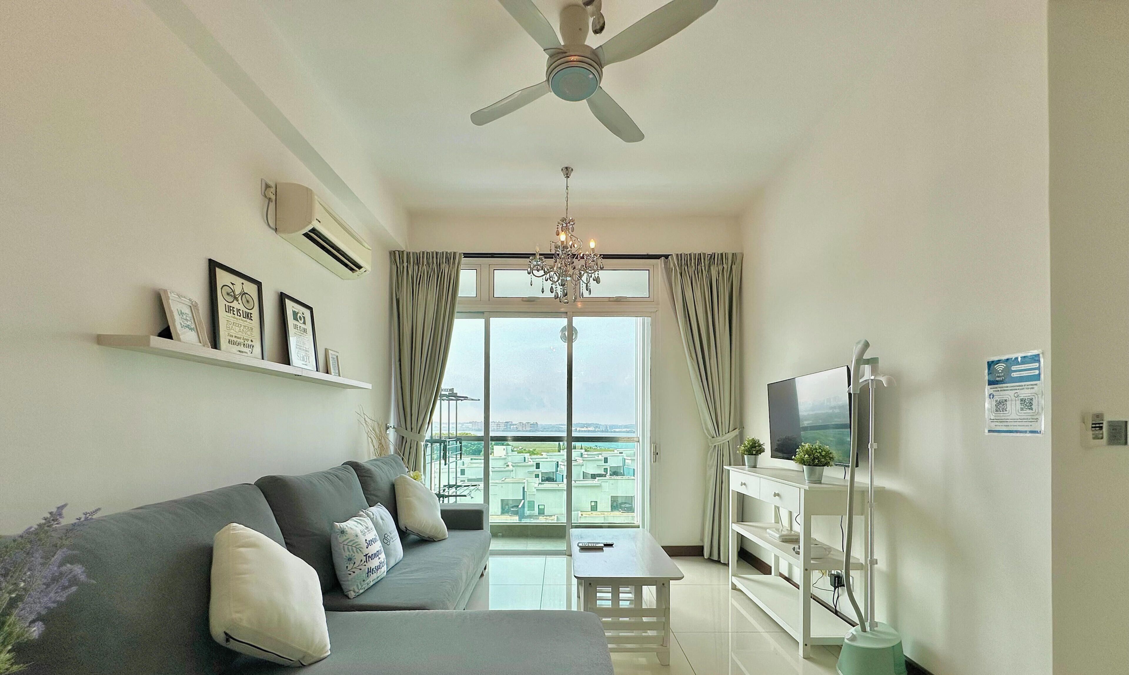 Departamento Confort, vista al mar | Área de sala de estar