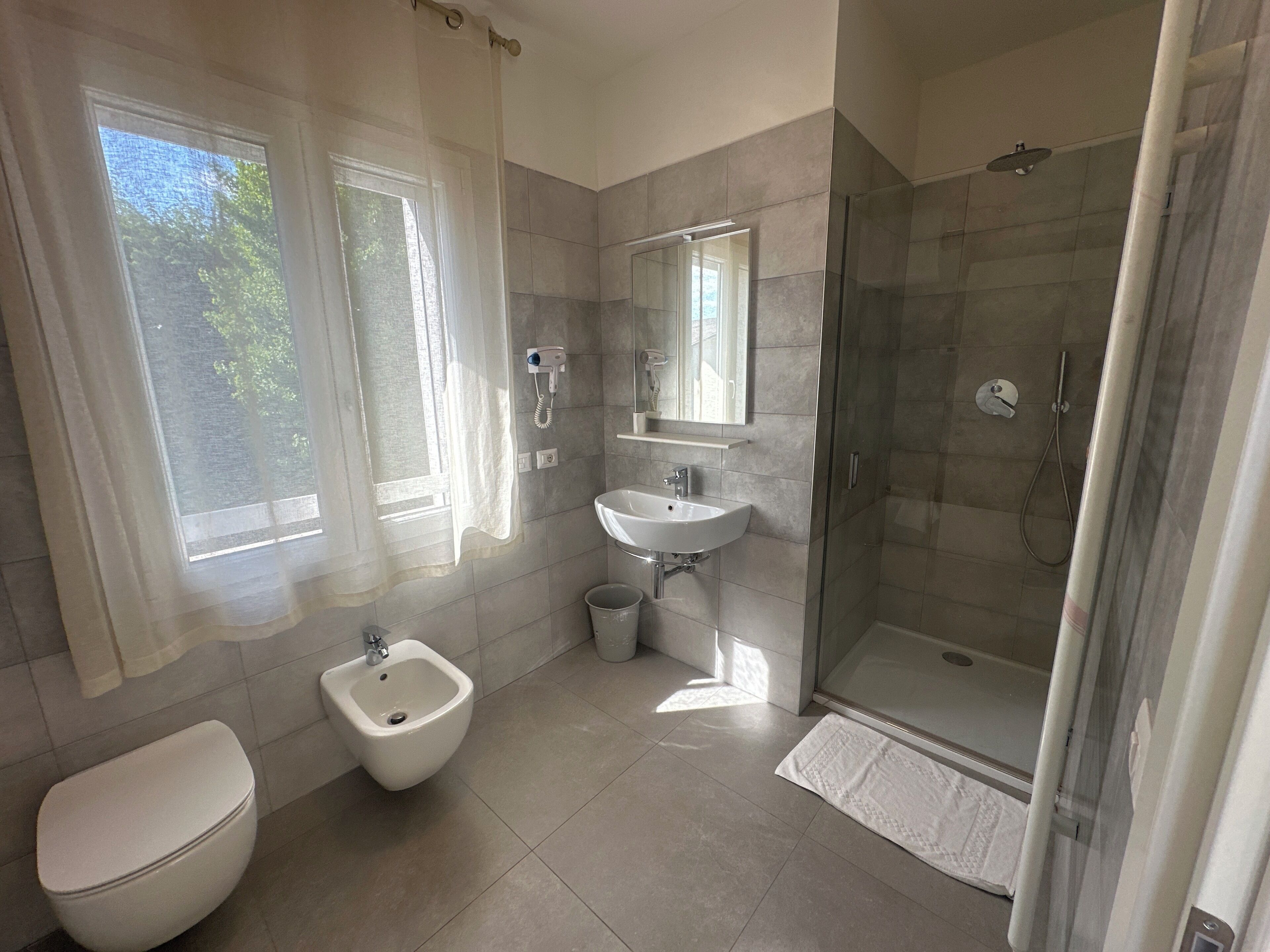 Standard Double Room | Bathroom | Shower, hair dryer, towels, soap