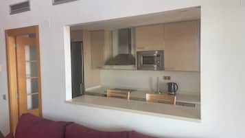 Penthouse, vista al mar | Área de sala de estar