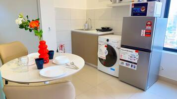 Superior Apartment, Private Bathroom, City View | Private kitchen | Dining tables