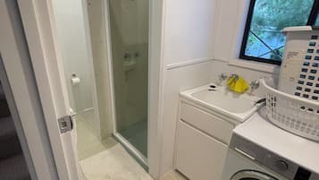 Shower, towels, soap, toilet paper