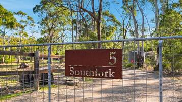 A fenced area with a sign reading '5 Southfork.'