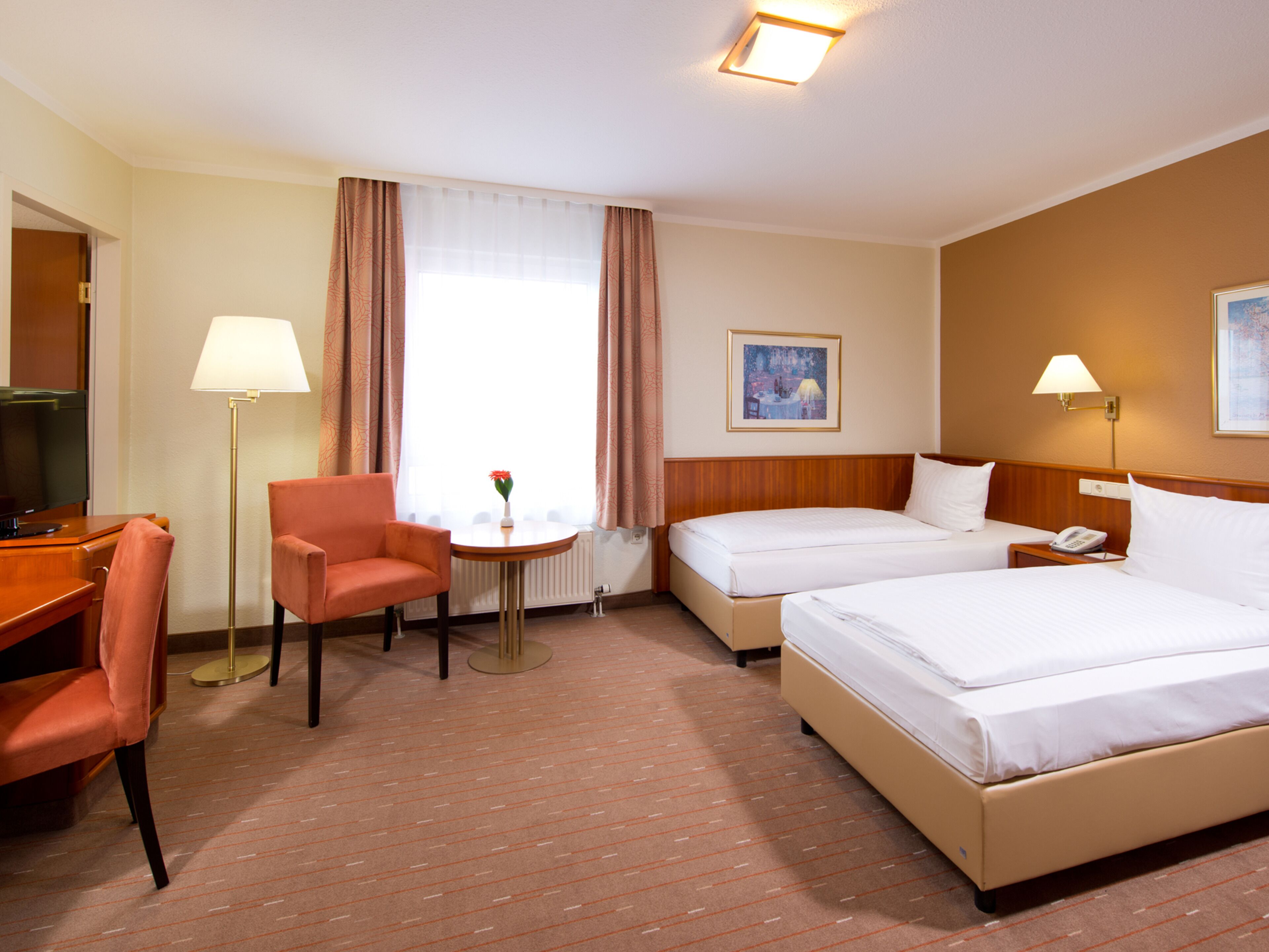 Sink into crisp bedding and relax in a warm, spacious room.