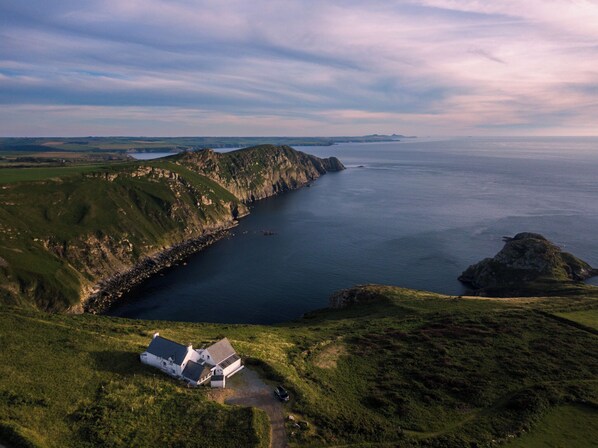 Aerial view - Cliff-top converted farmhouse in the Pembrokeshire Coast National Park. (Goodwick)