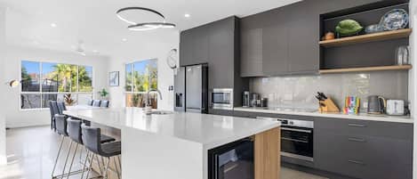 Coffee/tea maker, fridge, microwave, oven
