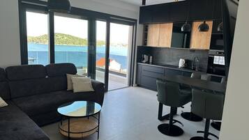 Apartment, Balcony, Beach View | Living area | 45-inch LCD TV with satellite channels