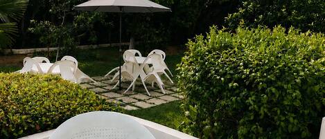 Standard Triple Room, Patio, Garden View | Terrace/patio