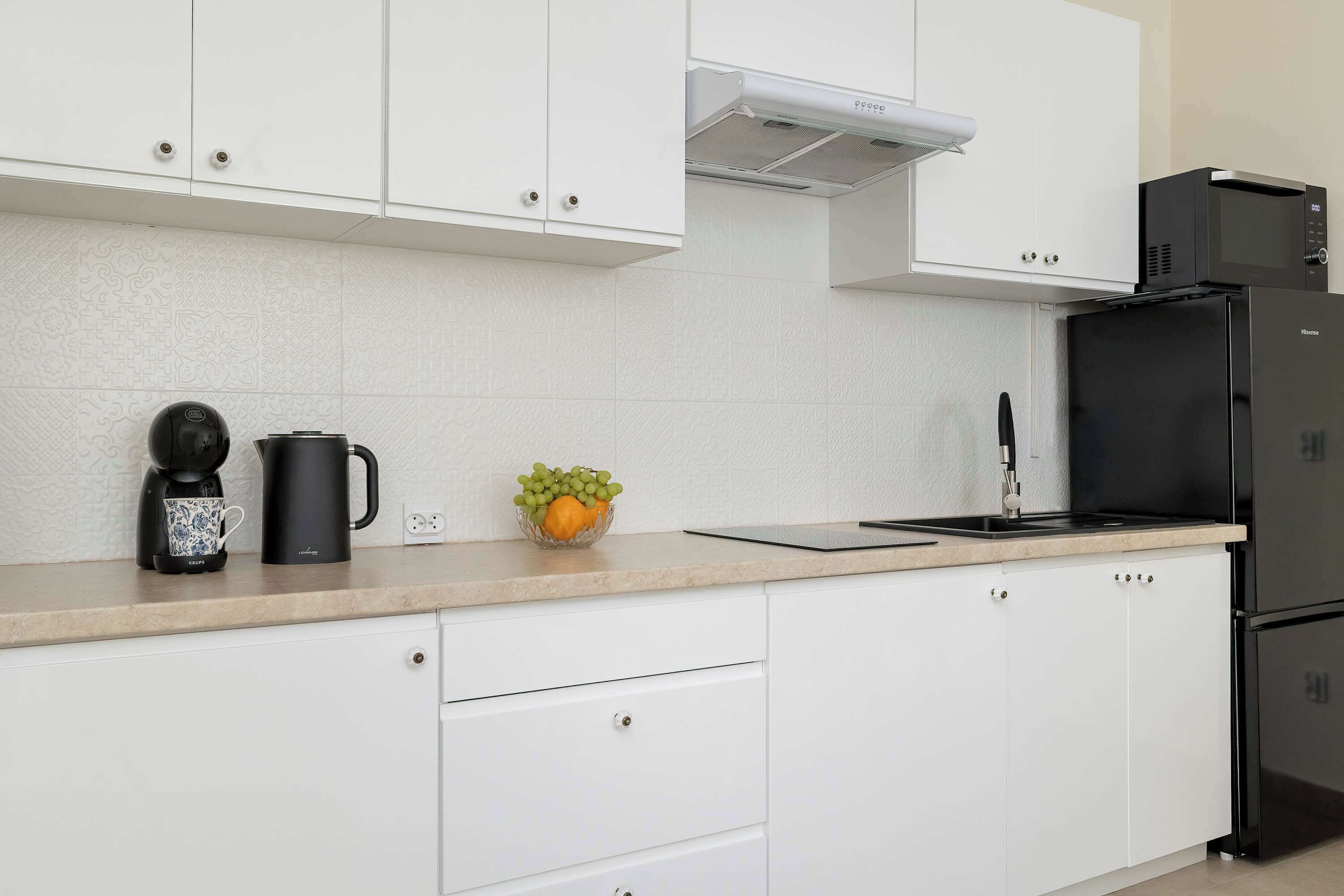 Fridge, microwave, stovetop, coffee/tea maker