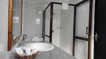 Standard Double Room | Bathroom | Shower, slippers, towels, soap