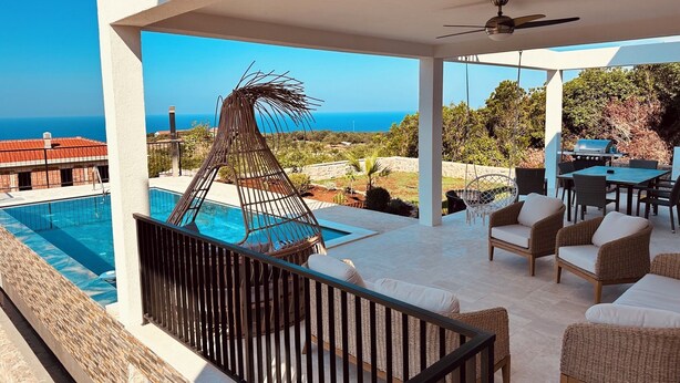 A balcony with a pool, outdoor furniture, and a view of the sea. - Serenity House—Private Infinity Pool, Panoramic Sea Views, and Near Budva (Krimovica)