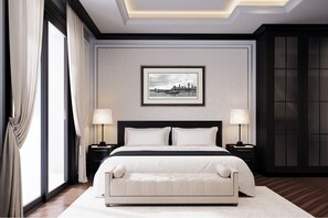 Una habitación de hotel moderna con una cama grande, dos mesitas de noche, una pequeña consola y un banco, además de un cuadro en la pared.