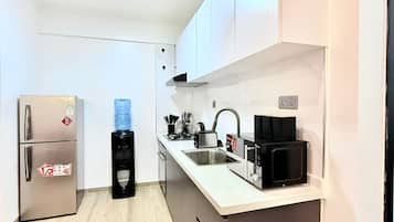 Fridge, microwave, cookware/dishes/utensils