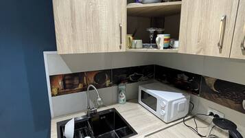 Fridge, microwave, cookware/dishes/utensils