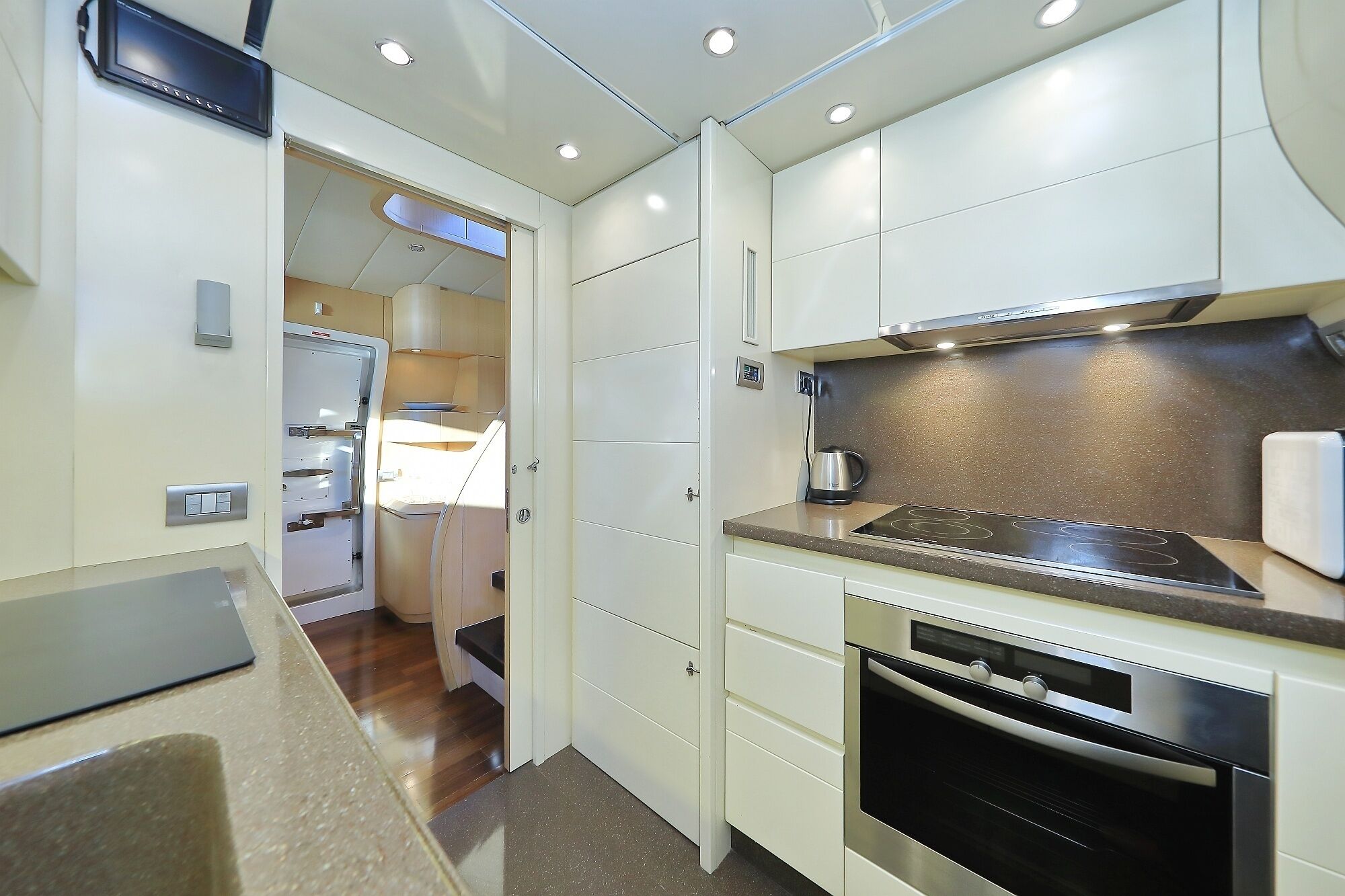 A compact kitchen with a stove, oven, and a small countertop.