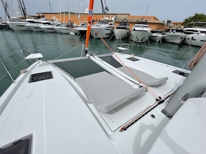 A marina with multiple boats docked.