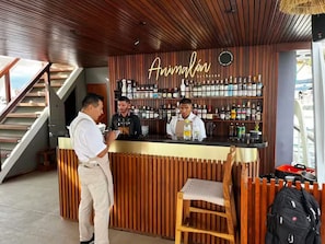 A bar area with a wooden interior and a sign that reads 'Animal by the sea'. - Getway with an incredible pool Marina Bay view! (Cabo San Lucas)