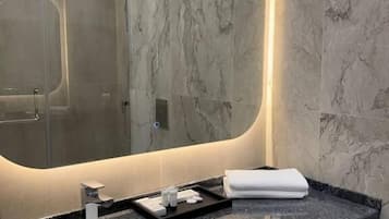 Shower, hair dryer, slippers, towels
