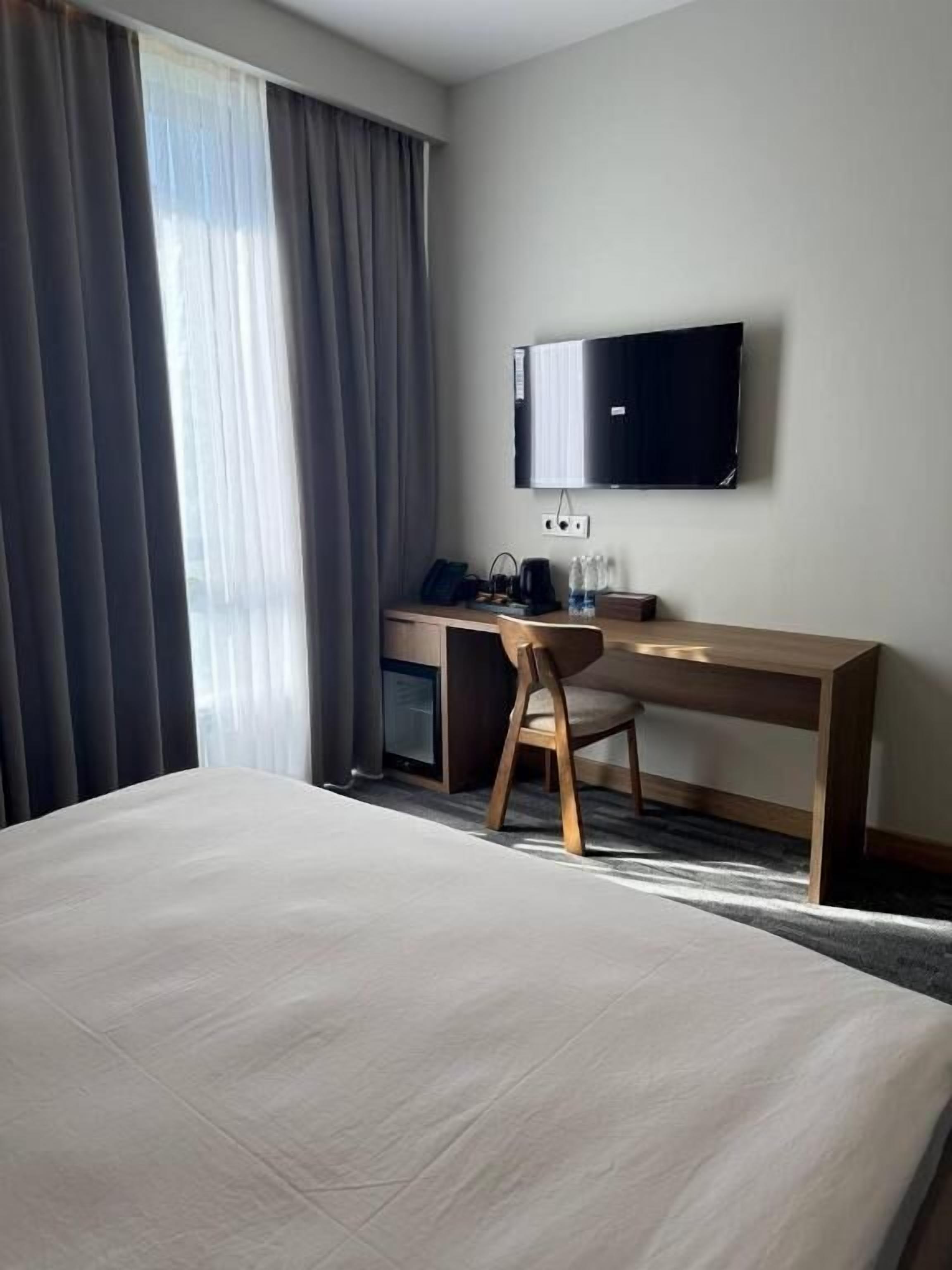 Standard Double Room, City View | In-room safe, desk, laptop workspace, blackout drapes