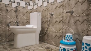 Deluxe Room | Bathroom | Shower, towels, soap, shampoo - HOTEL GANGA RAM (Chitrakoot)