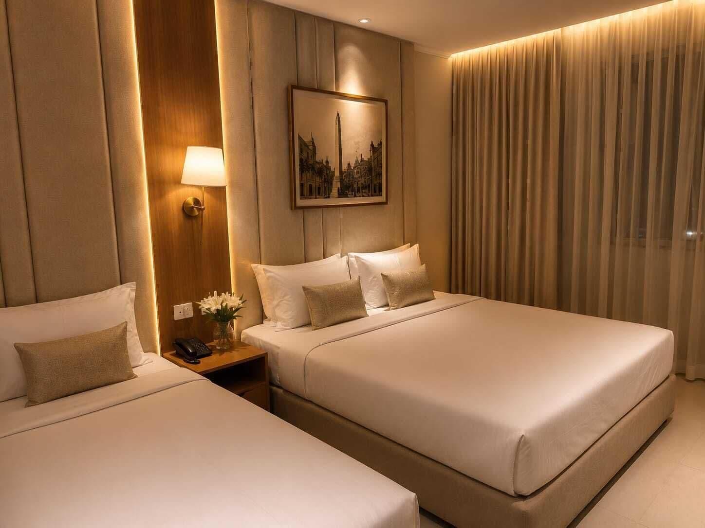 Habitación familiar, vista a la ciudad | Área de sala de estar