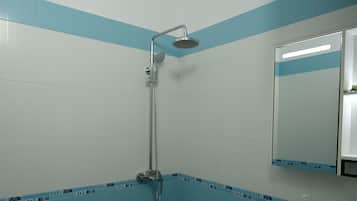 Deluxe Apartment, Balcony, Partial Sea View | Bathroom | Hair dryer, towels, soap, shampoo