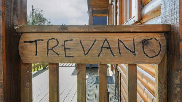A wooden sign with the name 'TREVANO' on a wooden deck. - Trevano (Bodmin)