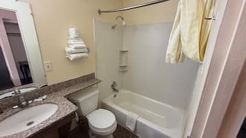 Bathtub, towels, soap, shampoo