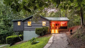A log cabin with a porch, a small attached structure, and a pathway leading to the entrance. - Visit Dollywood! 2 King Beds! Cedar Brooke Haven (Sevierville)