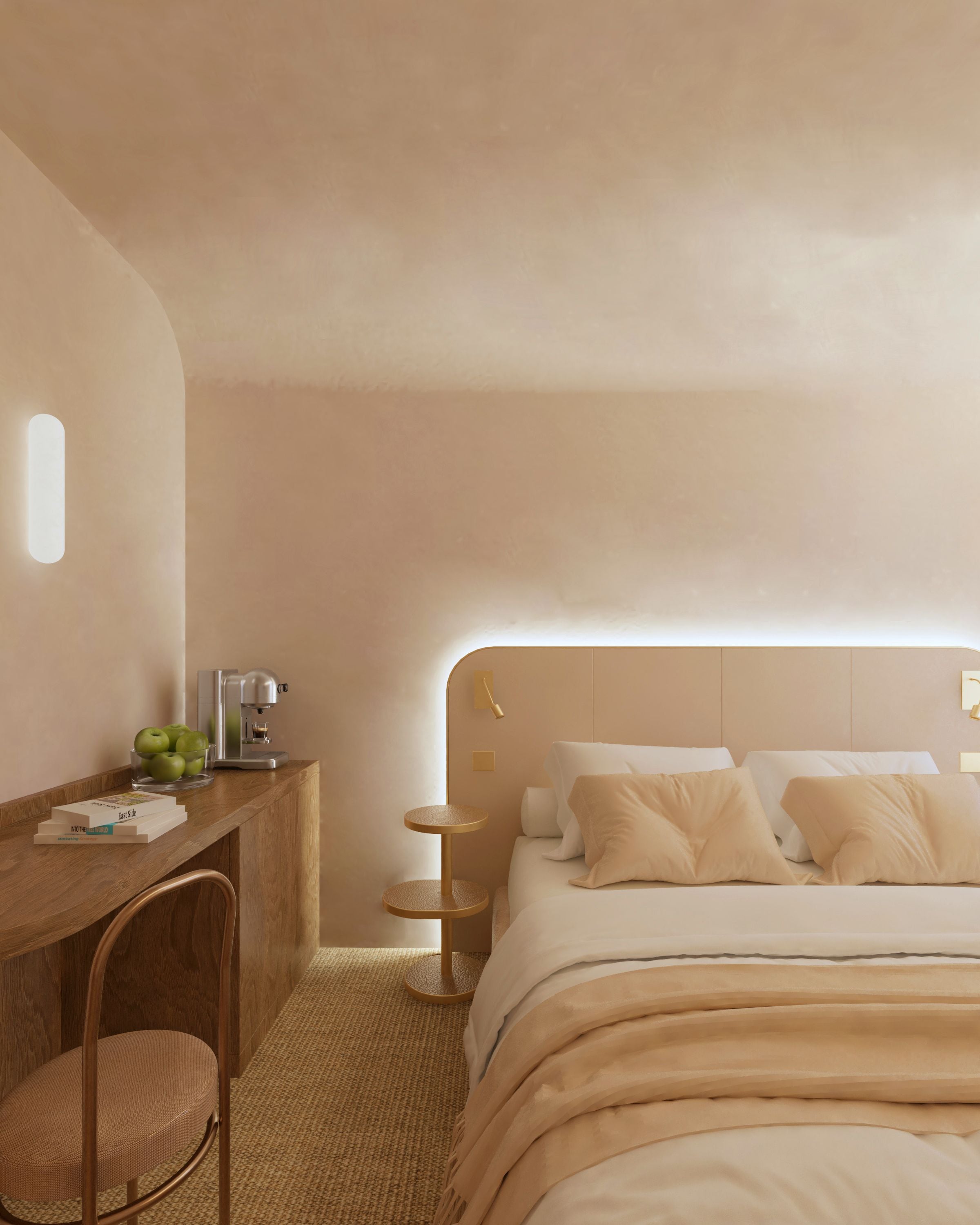Un dormitorio moderno con un escritorio de madera, un cuenco de manzanas verdes, una cafetera y una cama con muchos cojines.
