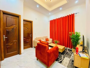 Living area - Furnished 1-bedroom apartment with a living room, fully equipped kitchen, and Wi-Fi (Brazzaville)