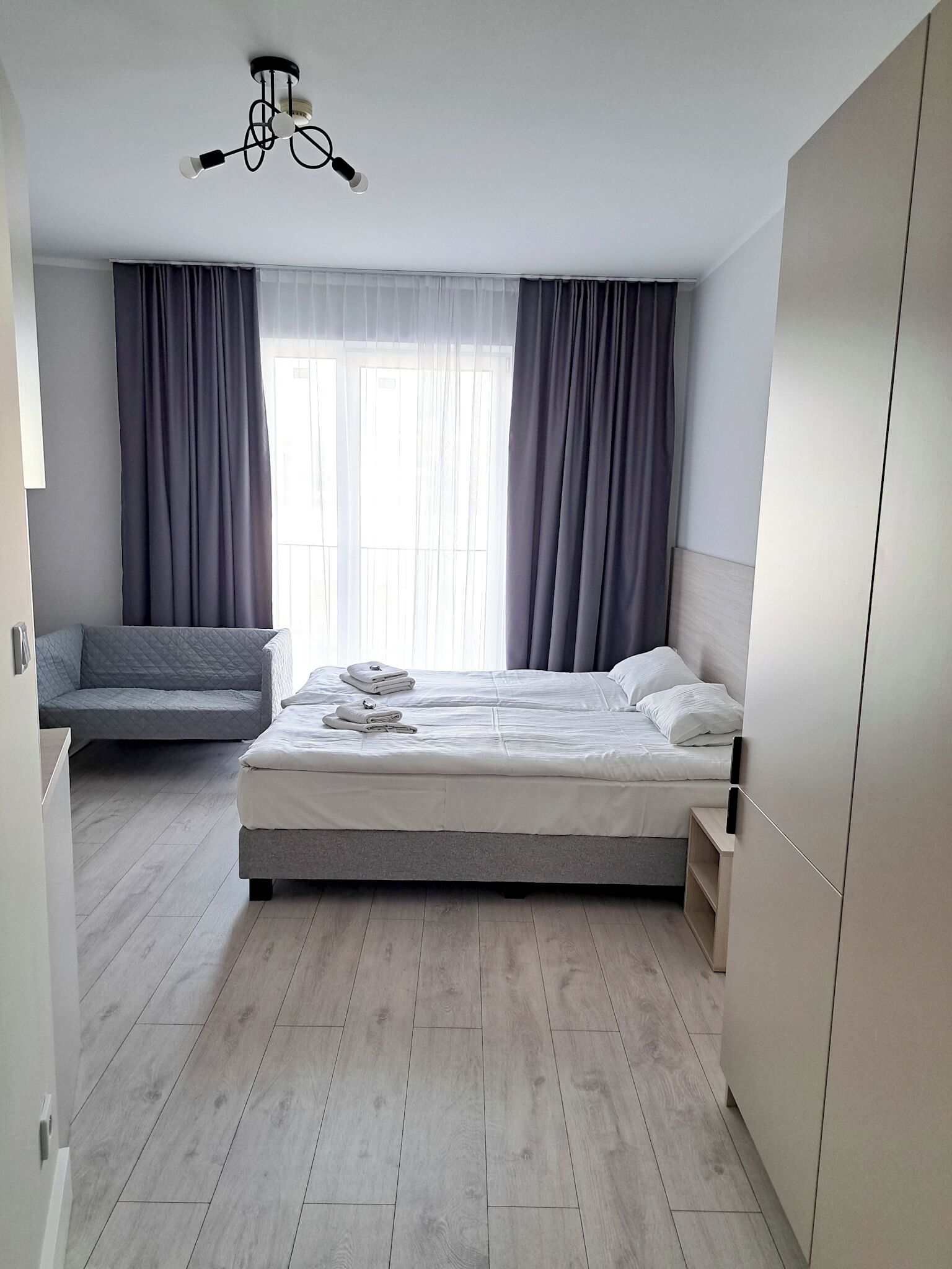 Apartment, 1 Queen Bed, Kitchenette | Desk, laptop workspace, blackout drapes, iron/ironing board