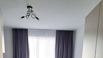 Apartment, 1 Queen Bed, Kitchenette | Desk, laptop workspace, blackout drapes, iron/ironing board