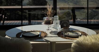 Cabin with earthen walls, bathtub, and outdoor fire pit | Villa Terrana